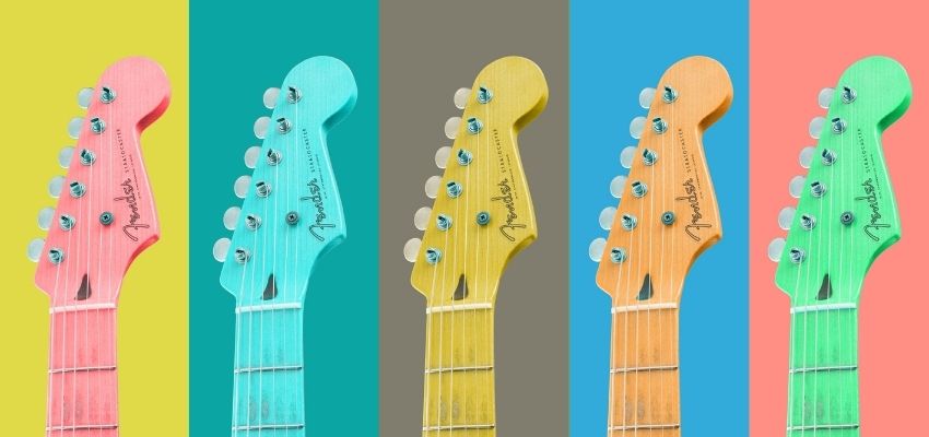 a row of colorful guitars